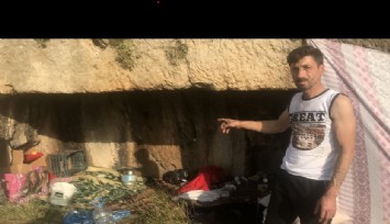 Evi yıkılan depremzede mağarada yaşıyor