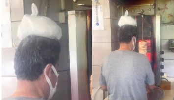 Döner ustası kafasında buz torbasıyla çalıştı