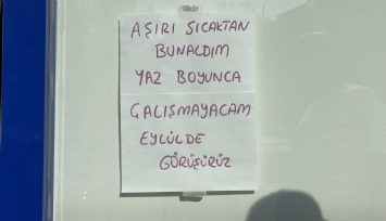 Sıcakların 45 dereceyi bulmasına dayanamayınca, iş yerine not asıp tatile çıktı