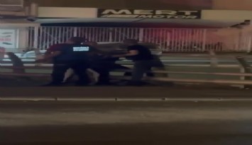 Köprülü kavşaktan kendisini atmak isteyen kadını polis engelledi
